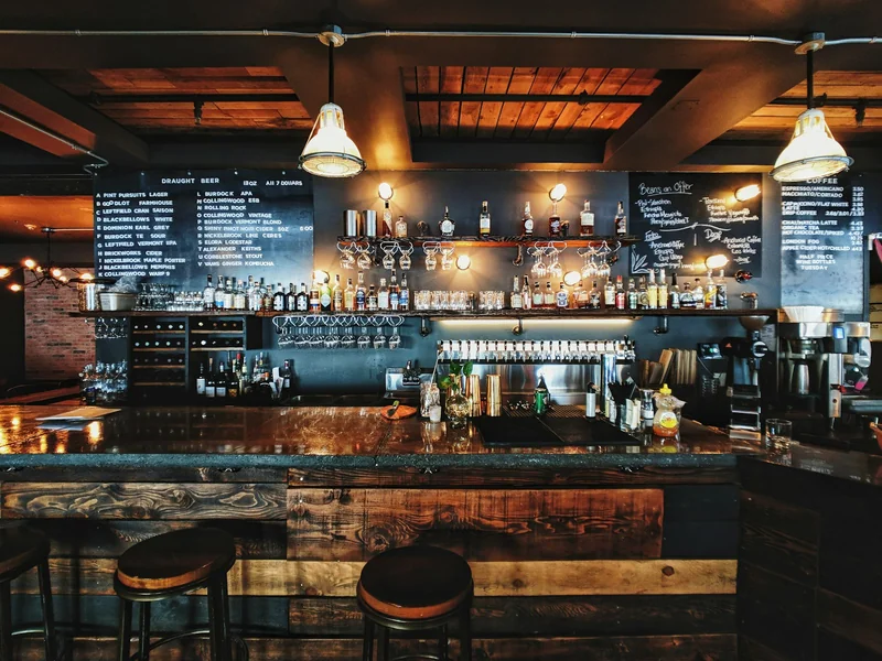 Craft beer taps lined up along a bar