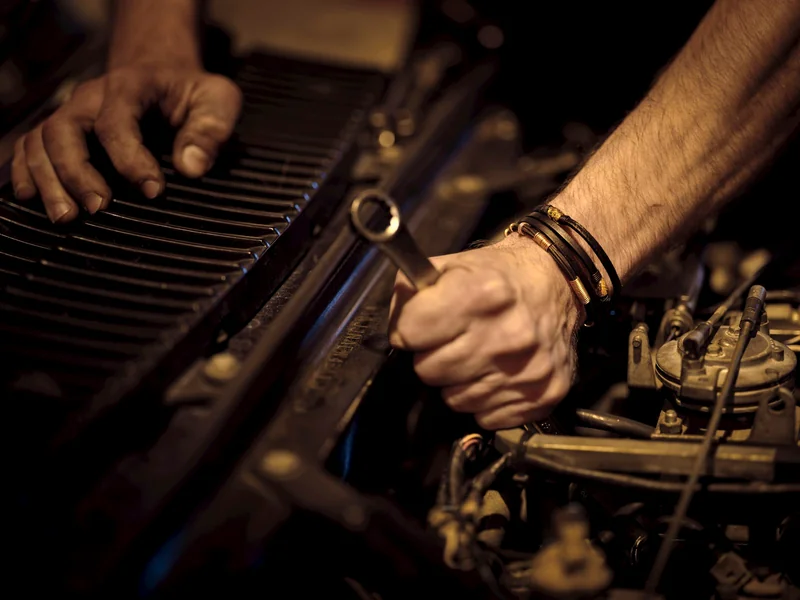 Mechanic servicing a car in a local garage
